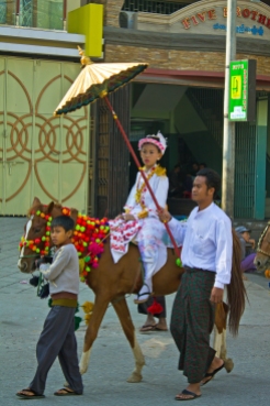 In Mandalay we were lucky to stumble upon a novitiate procession - young nuns on the way to the temple. Their costumes were stunning.
